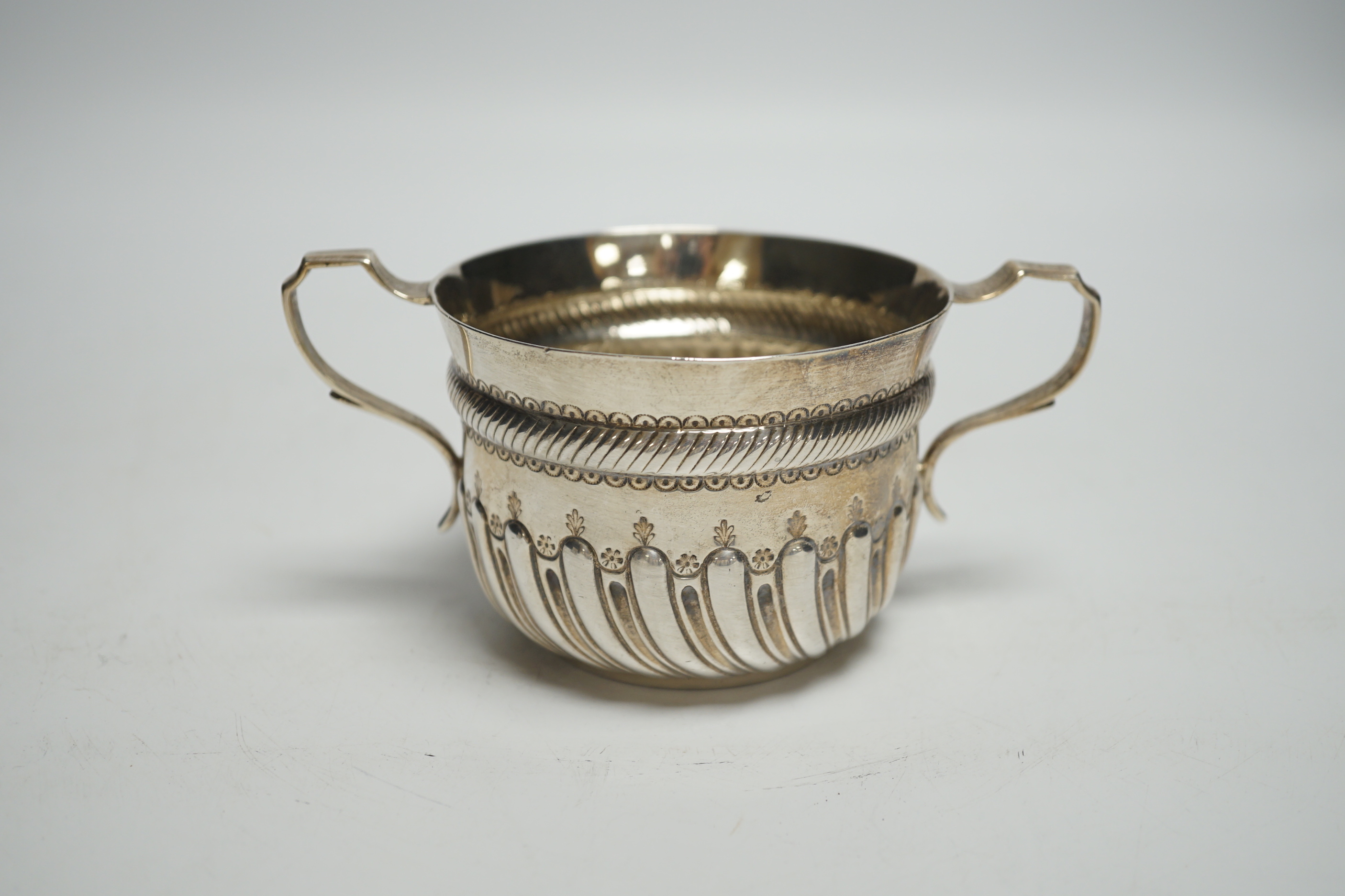 A late Victorian demi fluted silver porringer, John Septimus Beresford, London, 1886, 4.7oz.